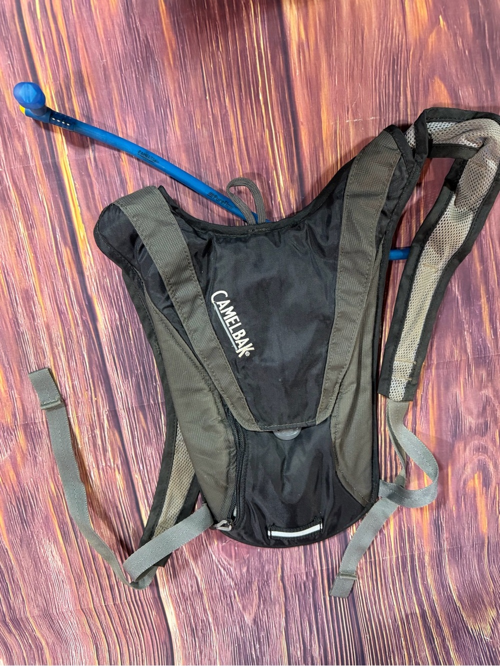 CamelBak Black and Gray Hydration Backpack with Blue Drinking Tube holds 32 oz